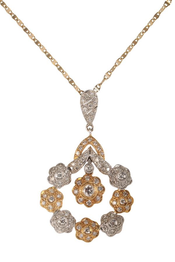 A WHITE AND YELLOW GOLD DIAMOND CLUSTER PENDANT NECKLACE