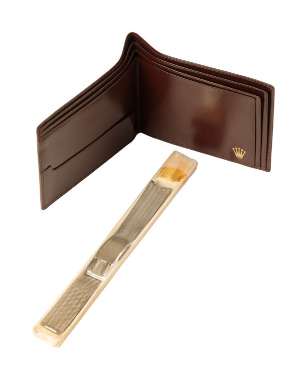 ROLEX: A BROWN LEATHER WALLET