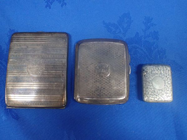 TWO SILVER CIGARETTE CASES AND A WHITE METAL VESTA CASE