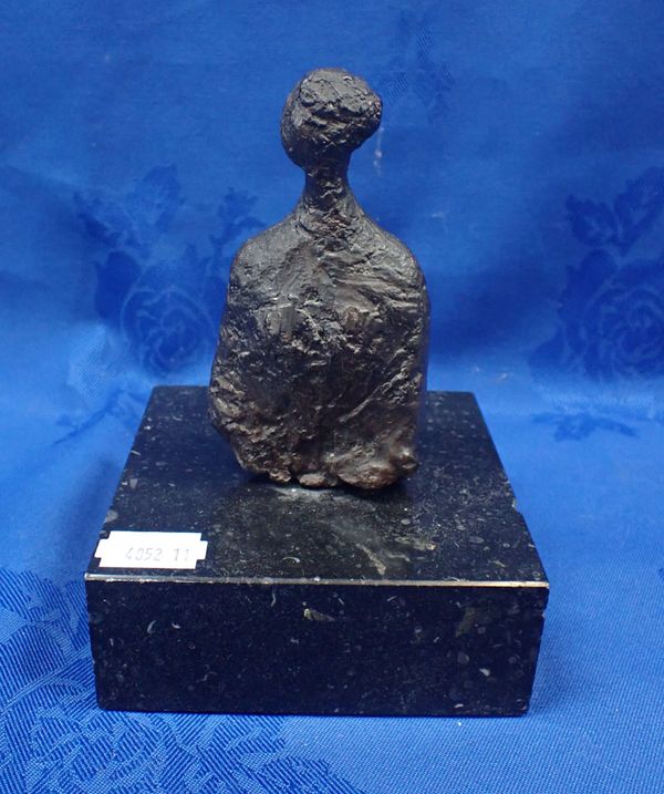 A  STYLISED CAST BRONZE FIGURE ON A MARBLE BASE