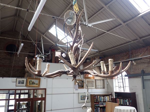 A KITSCH BARONIAL STYLE 'ANTLER' SIX-BRANCH CHANDELIER