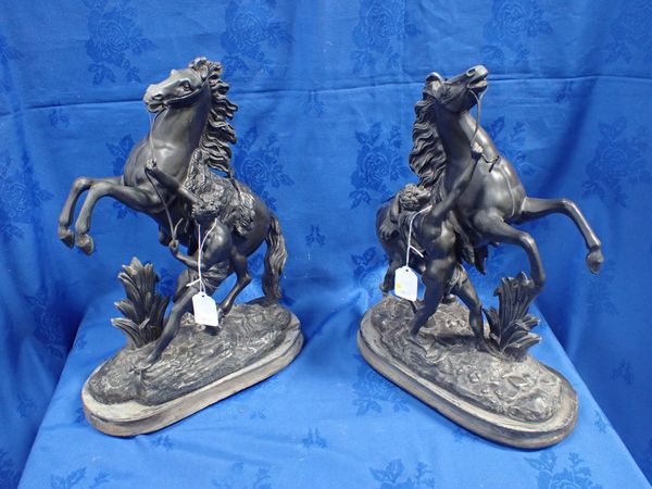 A PAIR OF PATINATED SPELTER 'MARLY' HORSES