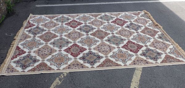 A MODERN CREAM-GROUND RUG