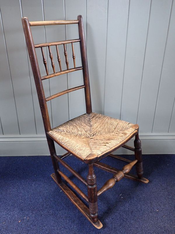 AN EARLY 19TH CENTURY COUNTRY-MADE ASH ROCKING CHAIR