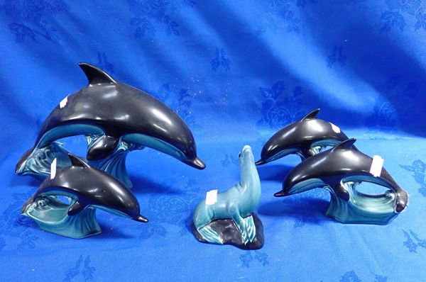 FOUR POOLE POTTERY DOLPHINS