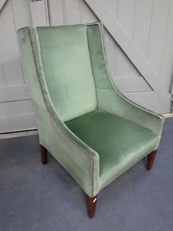 AN EDWARDIAN WING ARMCHAIR, IN THE LATE 18TH CENTURY STYLE