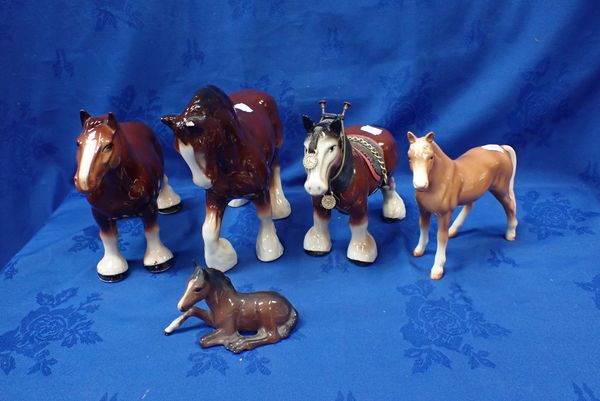 A BESWICK FOAL WITH OTHER SIMILAR HORSES