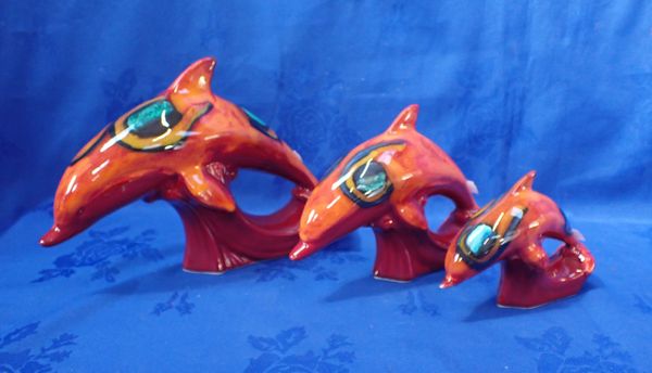 THREE POOLE POTTERY DOLPHINS IN DELPHIS COLOURS