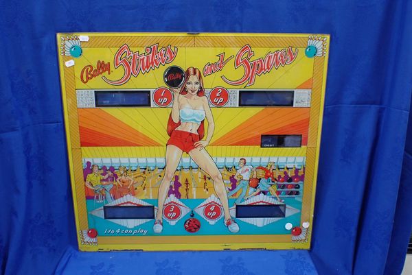 A 'BALLY STRIKES AND SPARES' PINBALL BACKGLASS