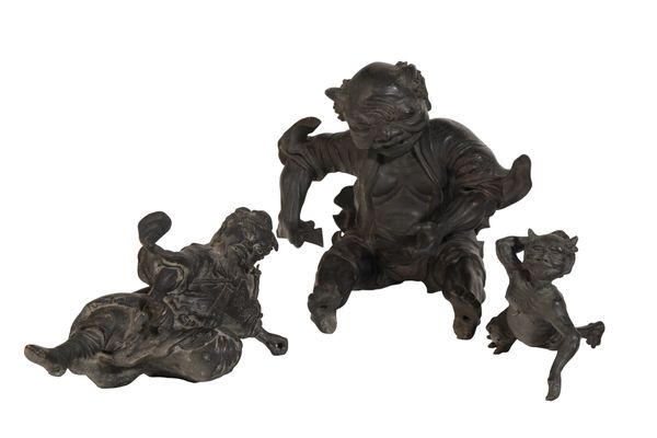 A LARGE JAPANESE BRONZE FIGURE OF A LAUGHING OMI ON HIS BACK