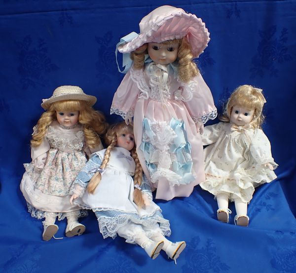 FOUR MODERN BISQUE DOLLS