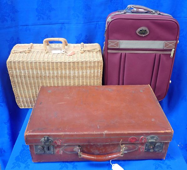 A VINTAGE LEATHER SUITCASE