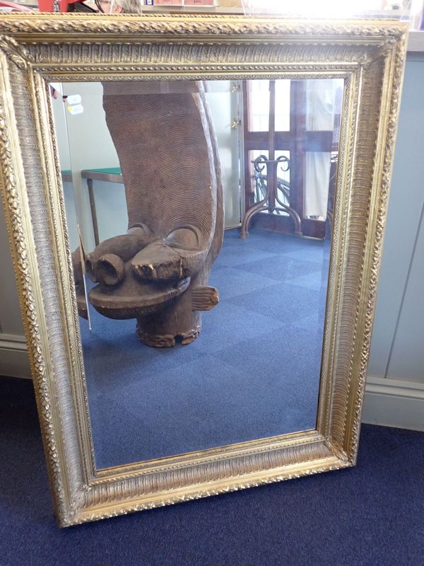 A GILT FRAMED WALL MIRROR