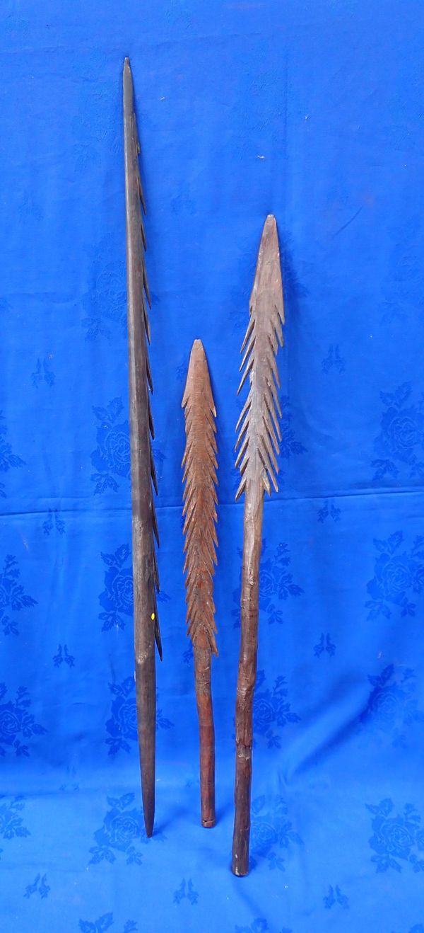 THREE TRIBAL WOODEN FISHING SPEARS