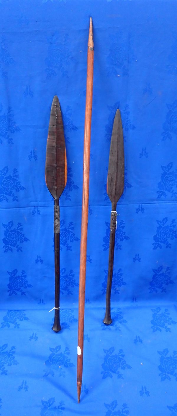 TWO TRIBAL SHORT WOODEN PADDLES OR IKLWAS