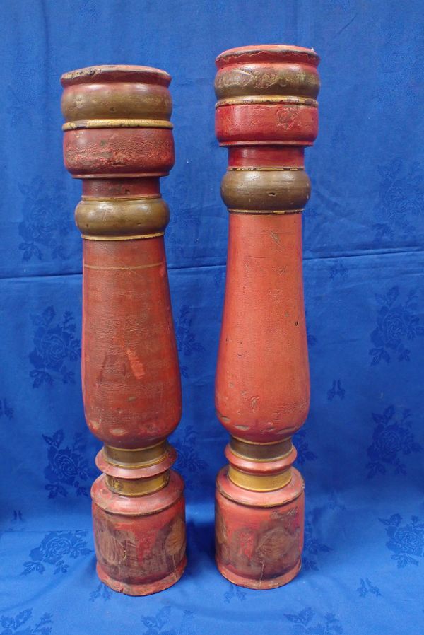 A NEAR PAIR OF TURNED AND PAINTED WOOD LARGE PRICKETT CANDLESTICKS