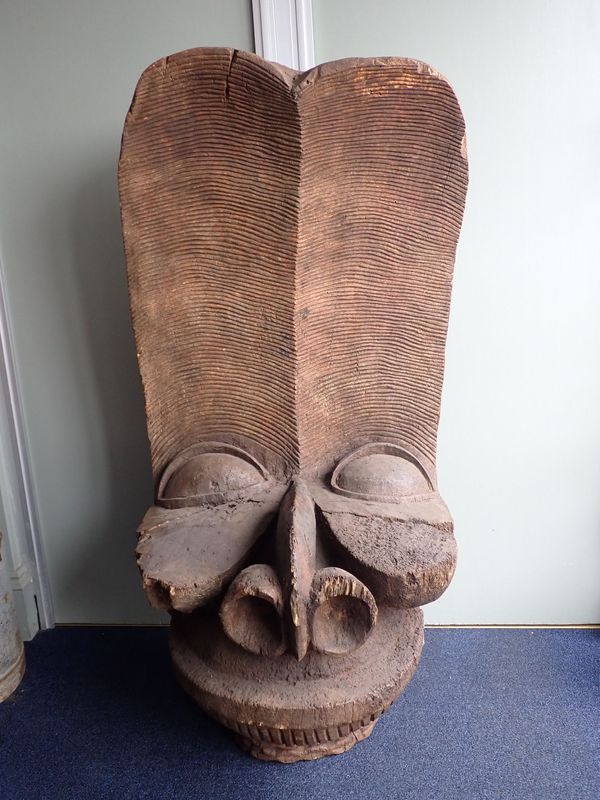 A LARGE AFRICAN TRIBAL CARVED WOODEN HEAD