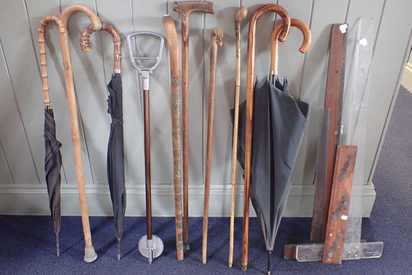 A COLLECTION OF WALKING STICKS, A SHOOTING STICK