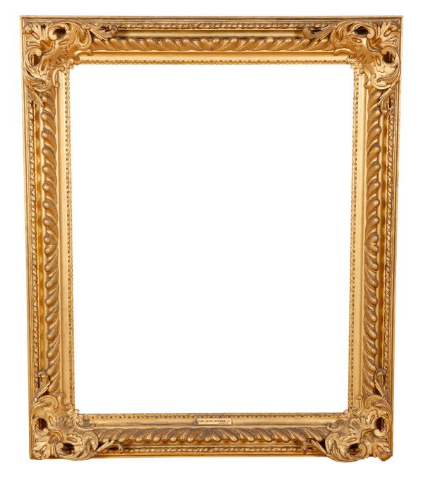 A 19TH CENTURY GILTWOOD AND COMPOSITION PICTURE FRAME