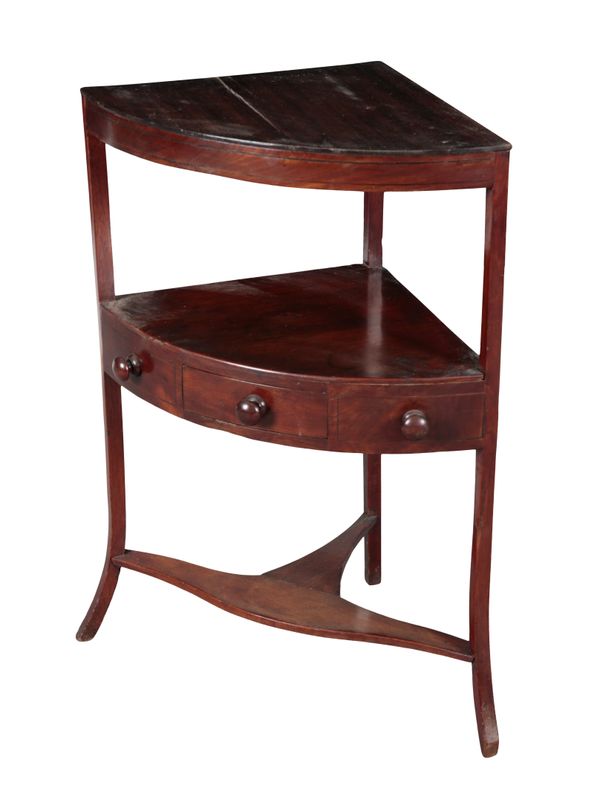 AN EARLY 19TH CENTURY MAHOGANY BOW-FRONT CORNER STAND