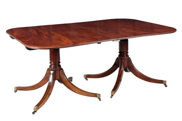 A FIGURED MAHOGANY TWO-PILLAR DINING TABLE IN GEORGE III STYLE