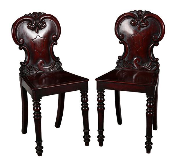 A PAIR OF VICTORIAN MAHOGANY HALL CHAIRS