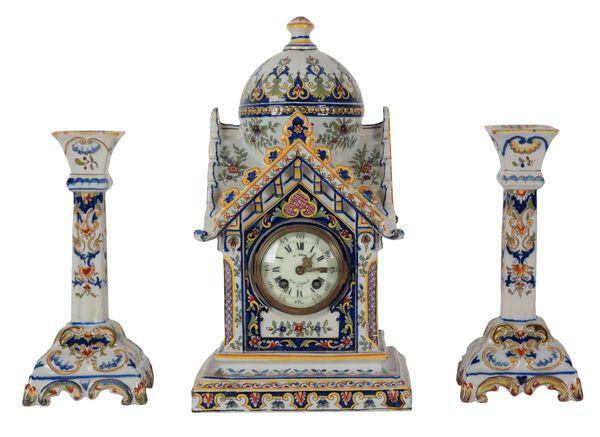 A FRENCH FAIENCE MANTEL CLOCK