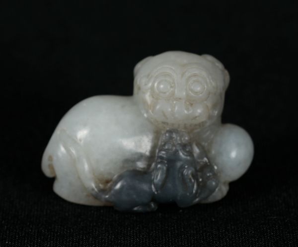 A CHINESE WHITE/PALE CELADON BUDDHISTIC LION AND CUB