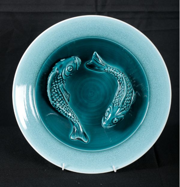 ALAN WHITE FOR POOLE POTTERY: A BLUE GLAZED CARP BOWL