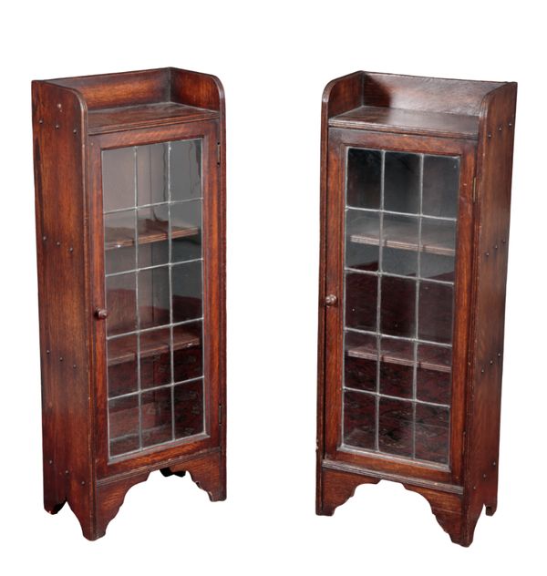 A PAIR OF 1930'S OAK LEADED GLAZED BOOKCASES