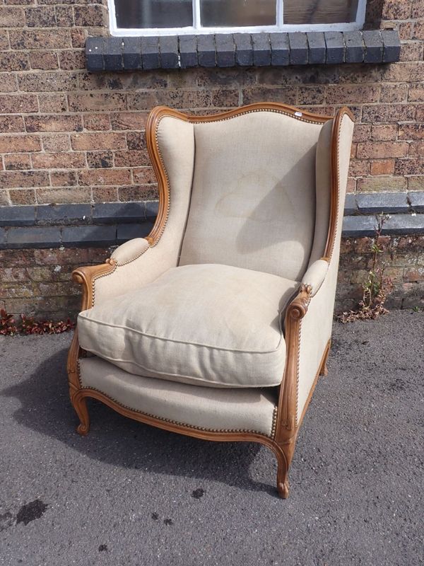 A FRENCH WING ARMCHAIR