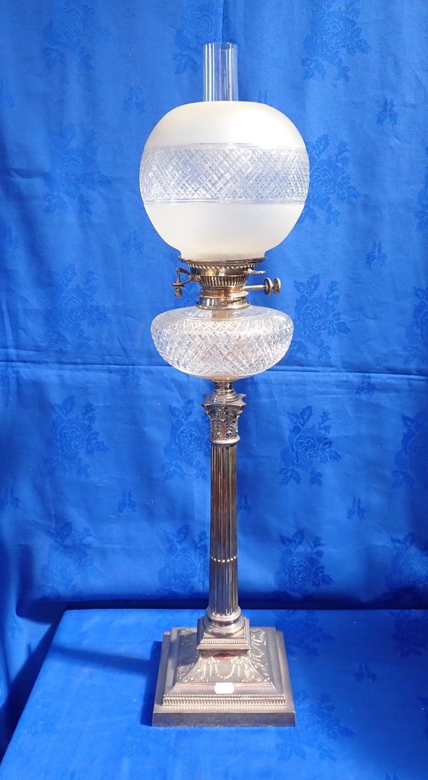AN EDWARDIAN SILVER-PLATED CORINTHIAN COLUMN OIL LAMP