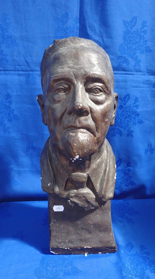 A PLASTER BUST OF A BEARDED MAN