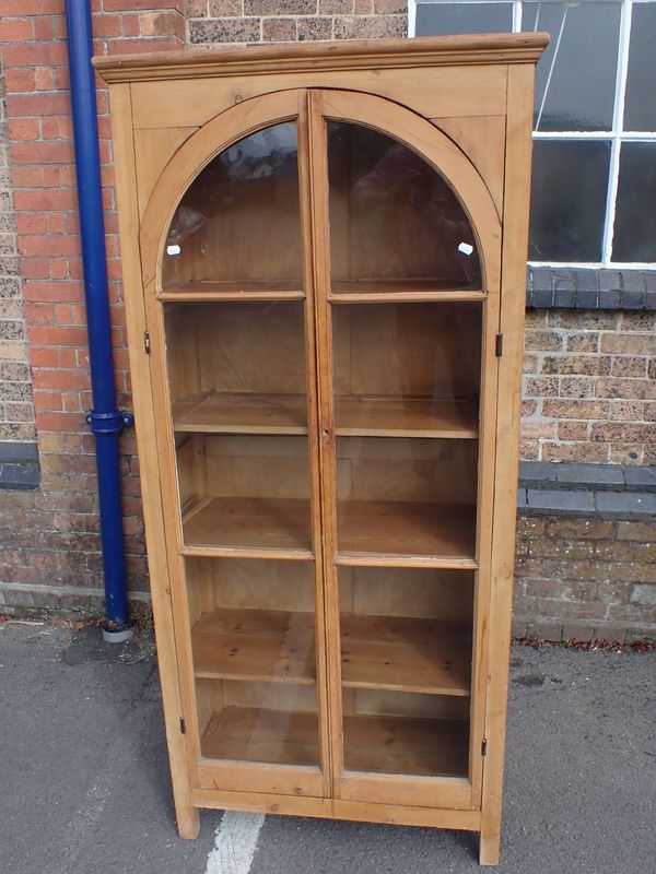 A 19TH CENTURY PINE GLAZED CABINET