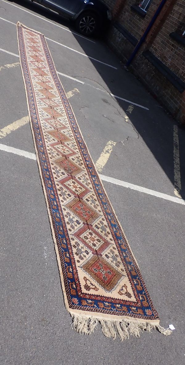 A LONG CREAM-GROUND TABRIZ RUNNER