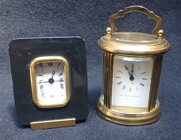 MATTHEW NORMAN, LONDON: OVAL-CASED CARRIAGE CLOCK TIMEPIECE