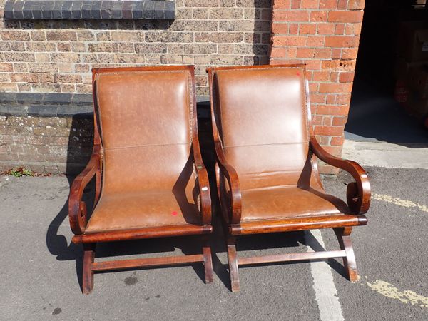 A PAIR OF COLONIAL STYLE ARMCHAIRS