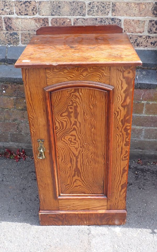 A VICTORIAN FIGURED PITCH PINE BEDSIDE POT CUPBOARD