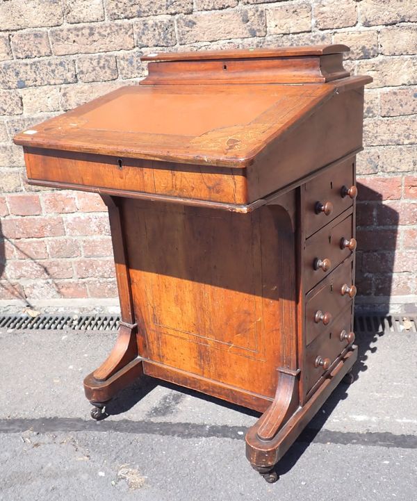 A VICTORIAN WALNUT DAVENPORT