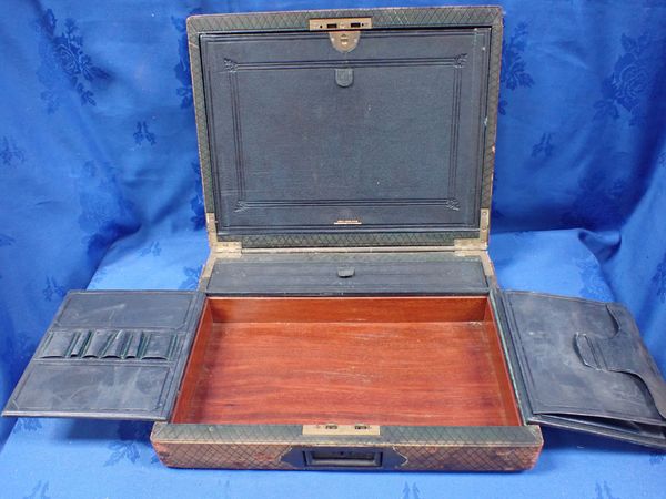 A 19TH CENTURY LEATHER COVERED WRITING BOX