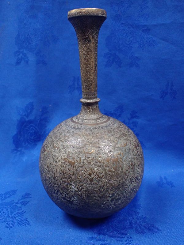 A PERSIAN BRASS VASE, ENGRAVED ALL OVER