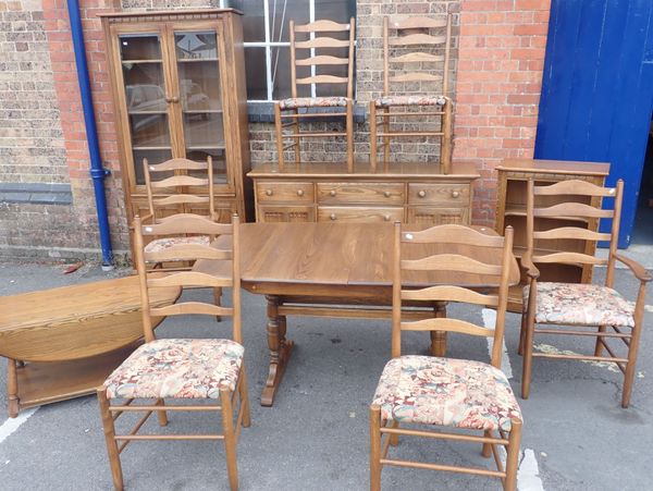 ERCOL: A MATCHED SUITE OF DINING FURNITURE