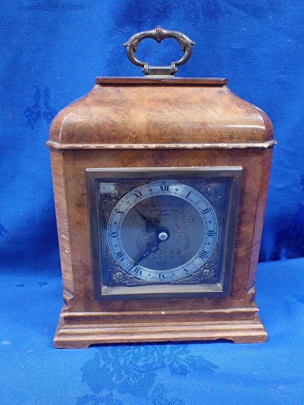 AN ELLIOTT CLOCK, RETAILED BY GARRARD & CO LTD, LONDON