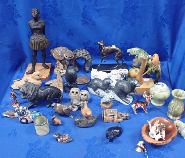 A COLLECTION OF STONE ANIMALS AND STATUES