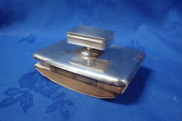 A SILVER ROCKING BLOTTER WITH STAMP BOX HANDLE