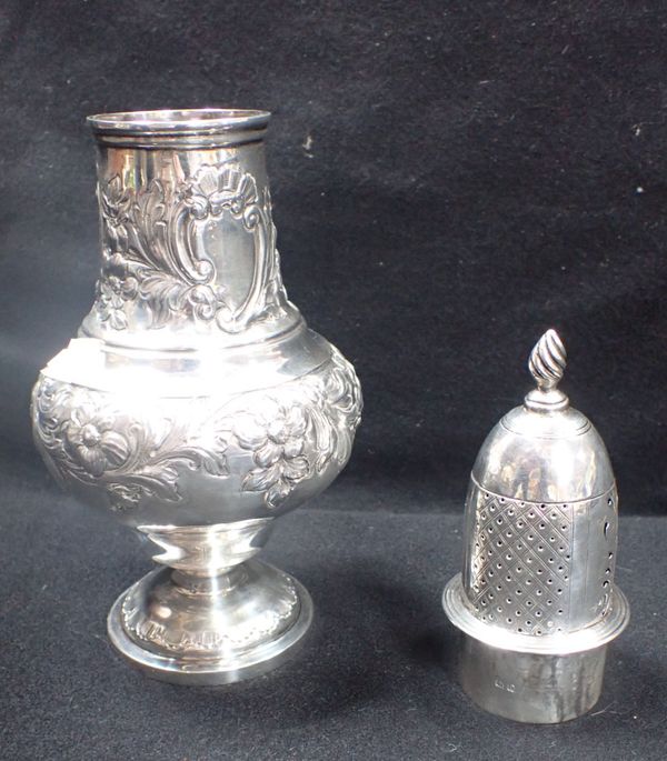 AN UNMARKED WHITE METAL REPOUSSE SUGAR CASTER