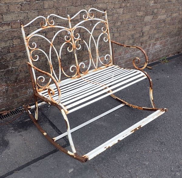 A METAL FRAMED ROCKING GARDEN SEAT FOR TWO