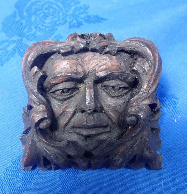 A CARVED WOOD GREEN MAN FIGURE