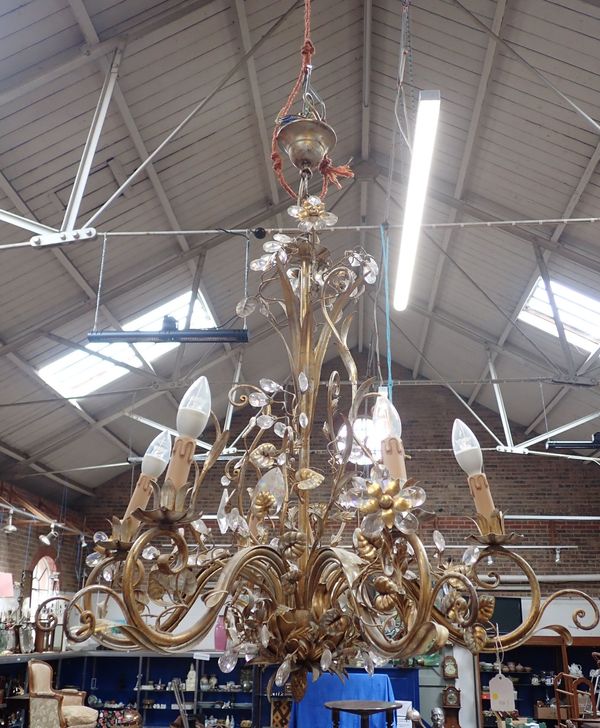 A SIX-BRANCH GILT METAL CHANDELIER, WITH GLASS DROPS