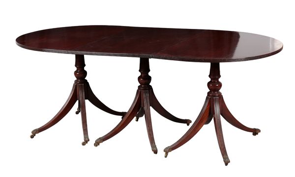 A GEORGE III STYLE MAHOGANY THREE-PILLAR DINING TABLE